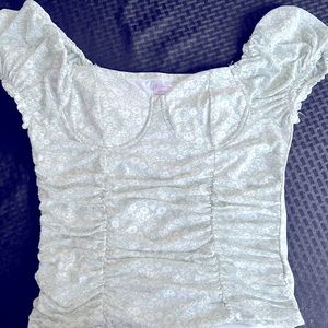 Sage green and white flora top with soft lined bust area.